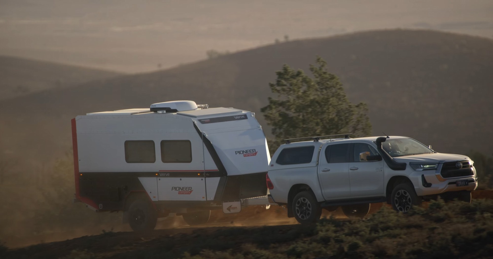 The Pioneer Campers Verve under tow at golden hour, shot for the launch film